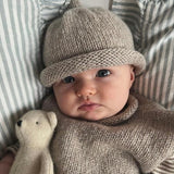 Baby girl wearing Oatmeal roll neck Vest and Beanie set