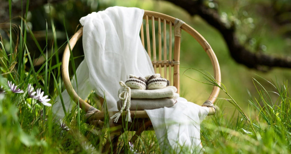 Baby knits on chair in the country