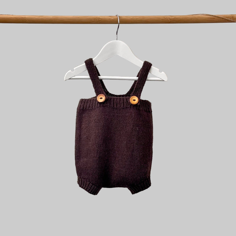 Baby romper in chocolate on hanger