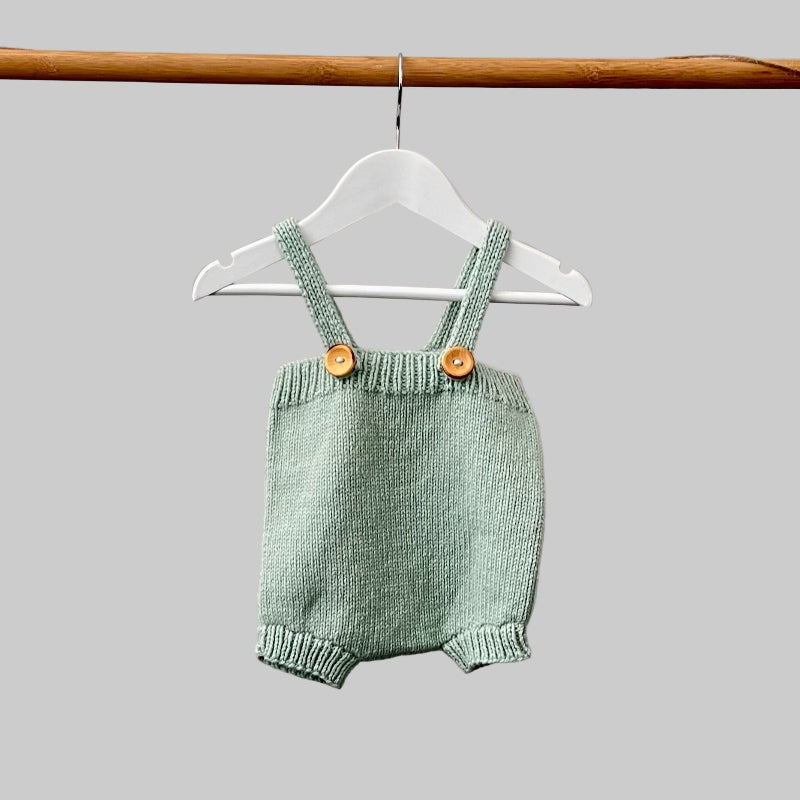 Baby romper in mint on hanger
