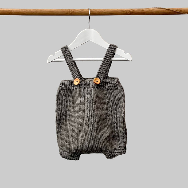 Baby romper in mushroom on hanger