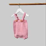 Baby romper in pink on hanger