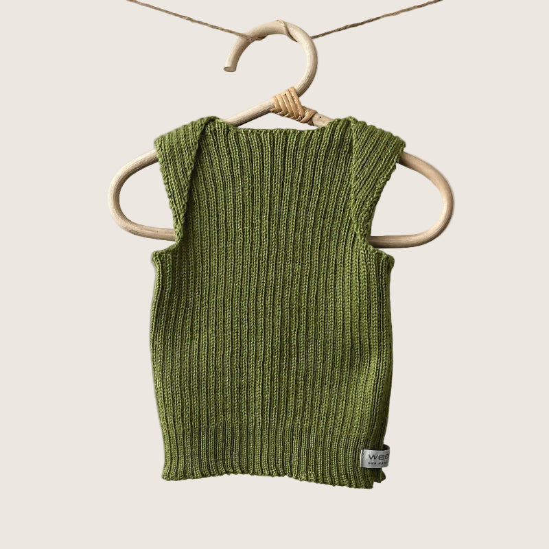 Moss ribbed baby singlet hanging on a wooden hanger against a plain background