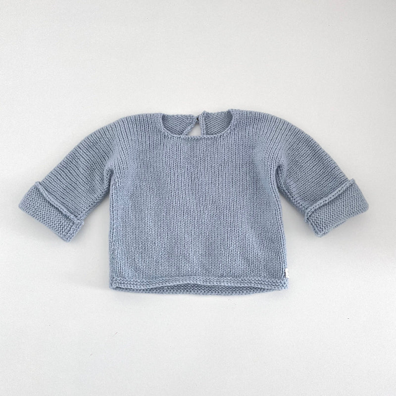 Powder blue knitted baby slouchy sweater on a white background