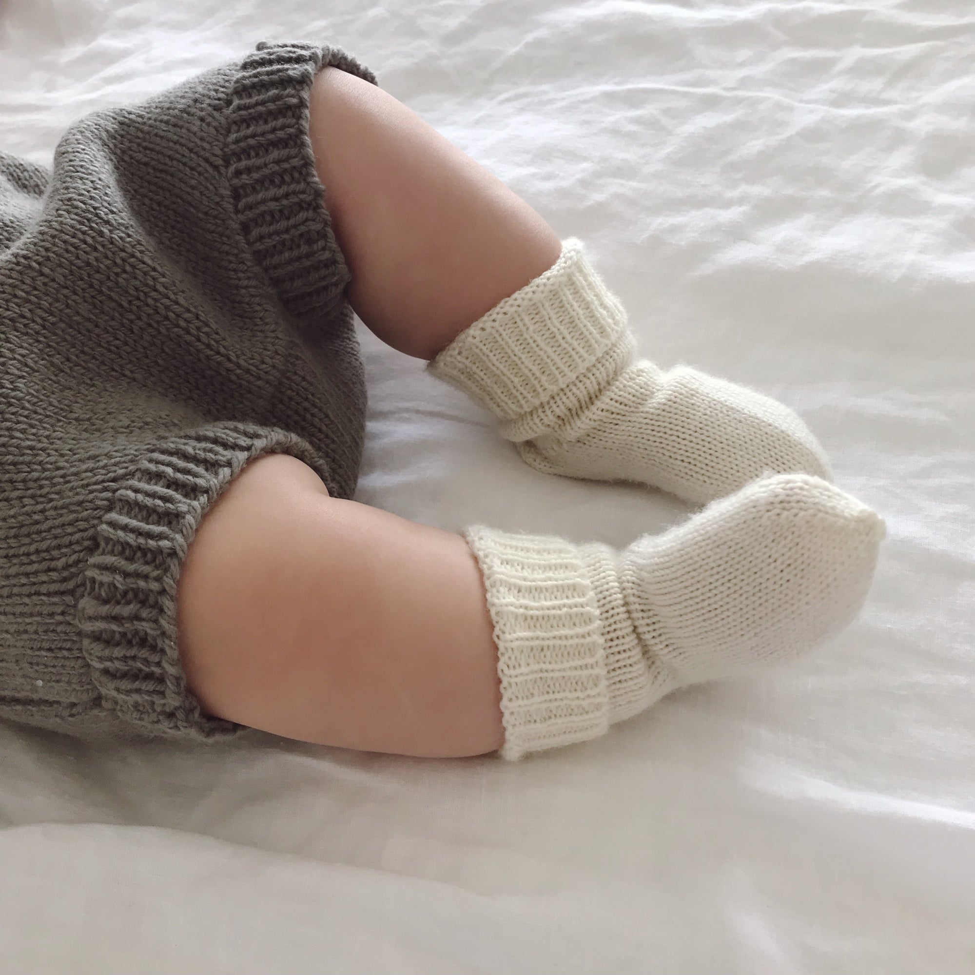 Baby wearing cream socks