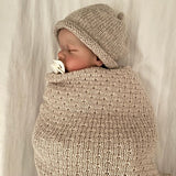 Baby wearing Oatmeal Beanie wrapped in Merino Oatmeal Wrap