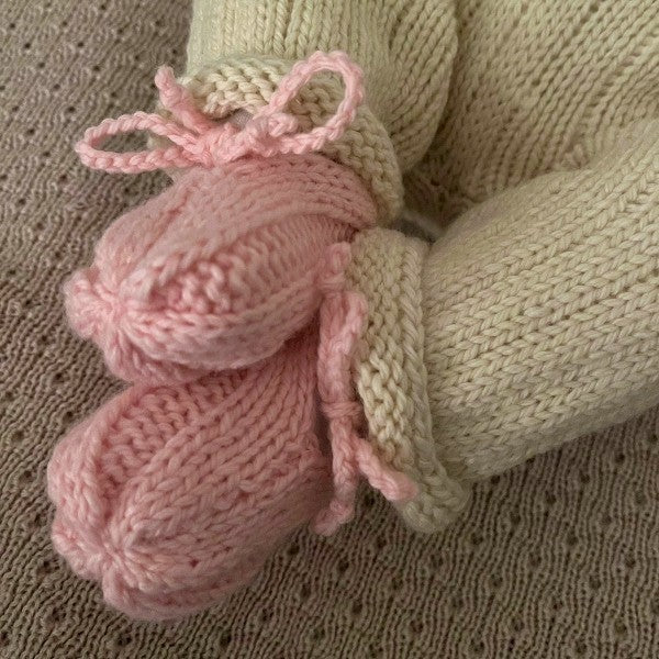 Baby wearing pink baby loafers