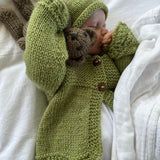 Baby wearing pistachio millie cardigan