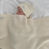 baby with natural merino buggy blanket
