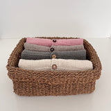 Basket with folded millie cardigans