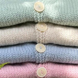 Cardigan stack of pastel colours with corozo buttons