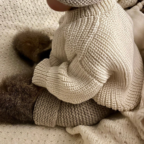 child wearing natural river jumper