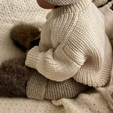 child wearing natural river jumper