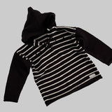 Chocolate and natural striped baby hoodie on a white surface