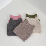 Selection of coloured tank tops on white shelf