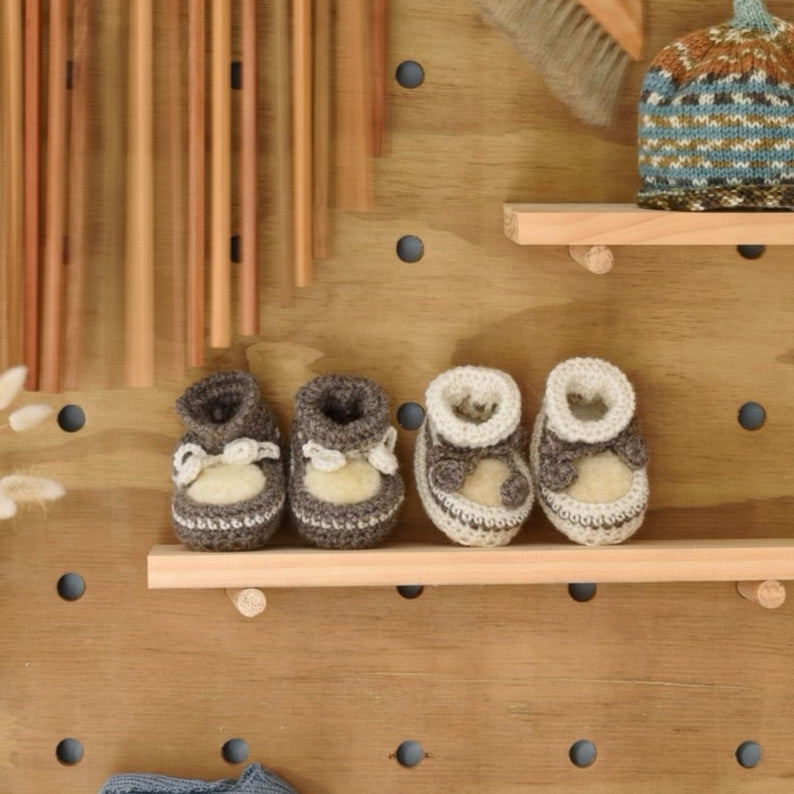 Crochet booties on a shelf
