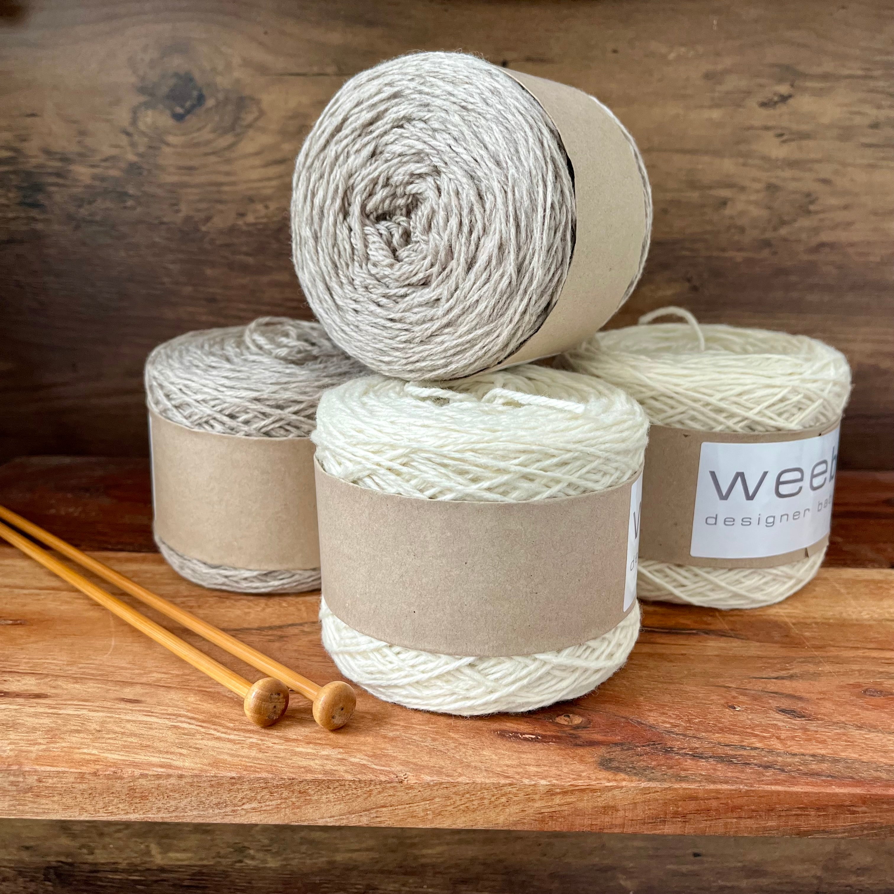 Four 100g balls of merino yarn