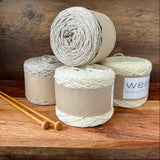 Four 100g balls of merino yarn