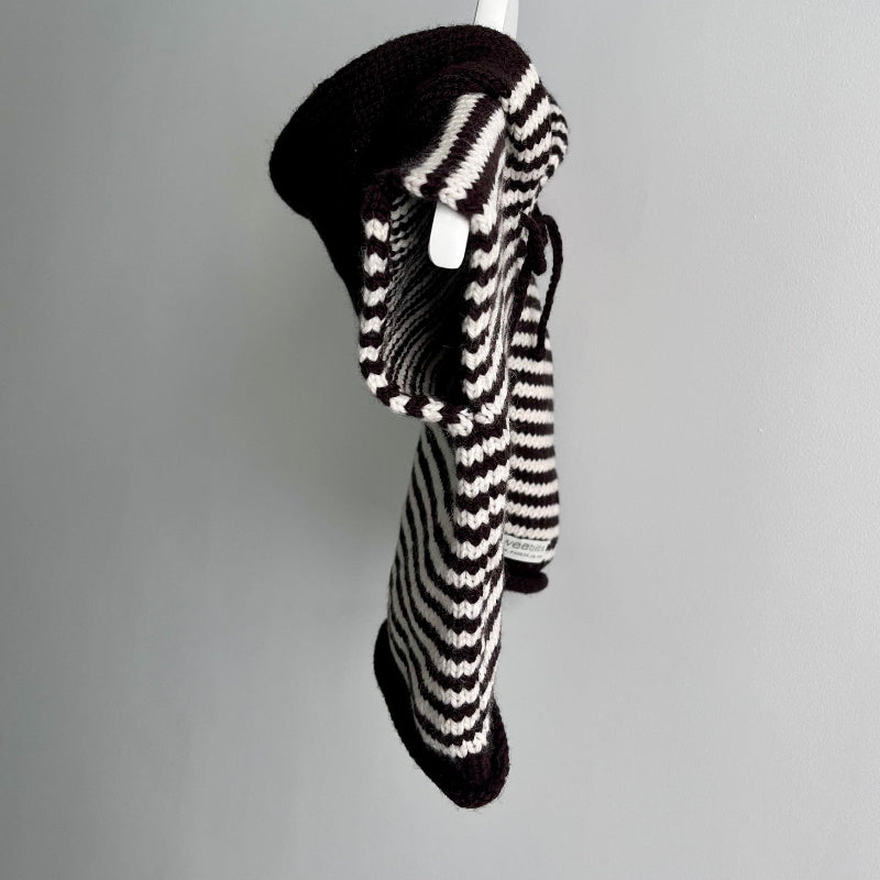 Side view of chocolate with natural stripe hooded vest