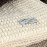 Merino bassinet blanket butter milk edge detail