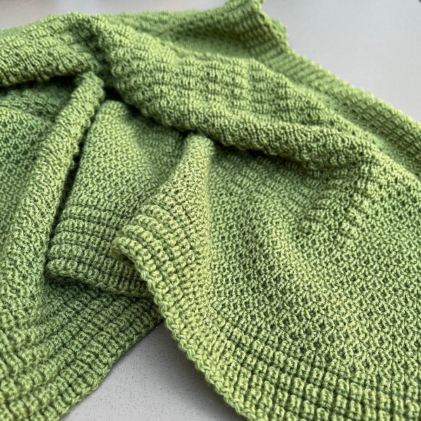 Merino bassinet blanket in moss