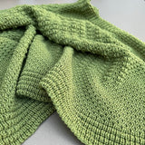 Merino bassinet blanket in moss