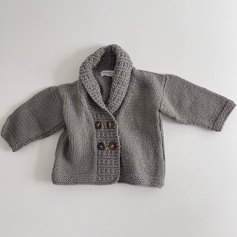 Mushroom knitted baby George jacket with buttons on a light grey background