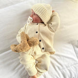 Sleeping baby wearing Ivory merino Marley set