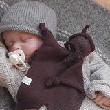 sleeping baby with brown snow baby comforter