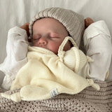 Sleeping baby with natural snow baby comforter