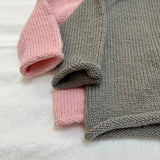 Sleeve and bottom detail of Roll Neck Jumper
