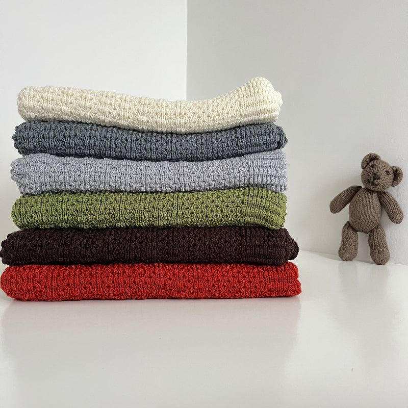 Stack of merino bassinet blankets