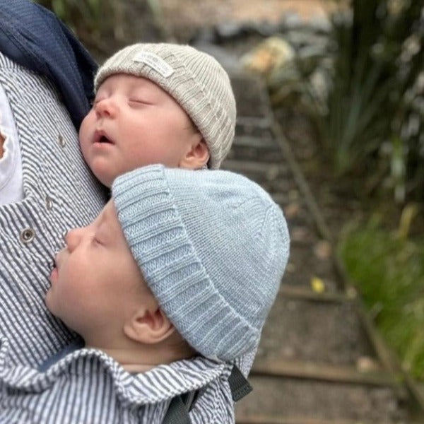 Twins wearing newborn beanies