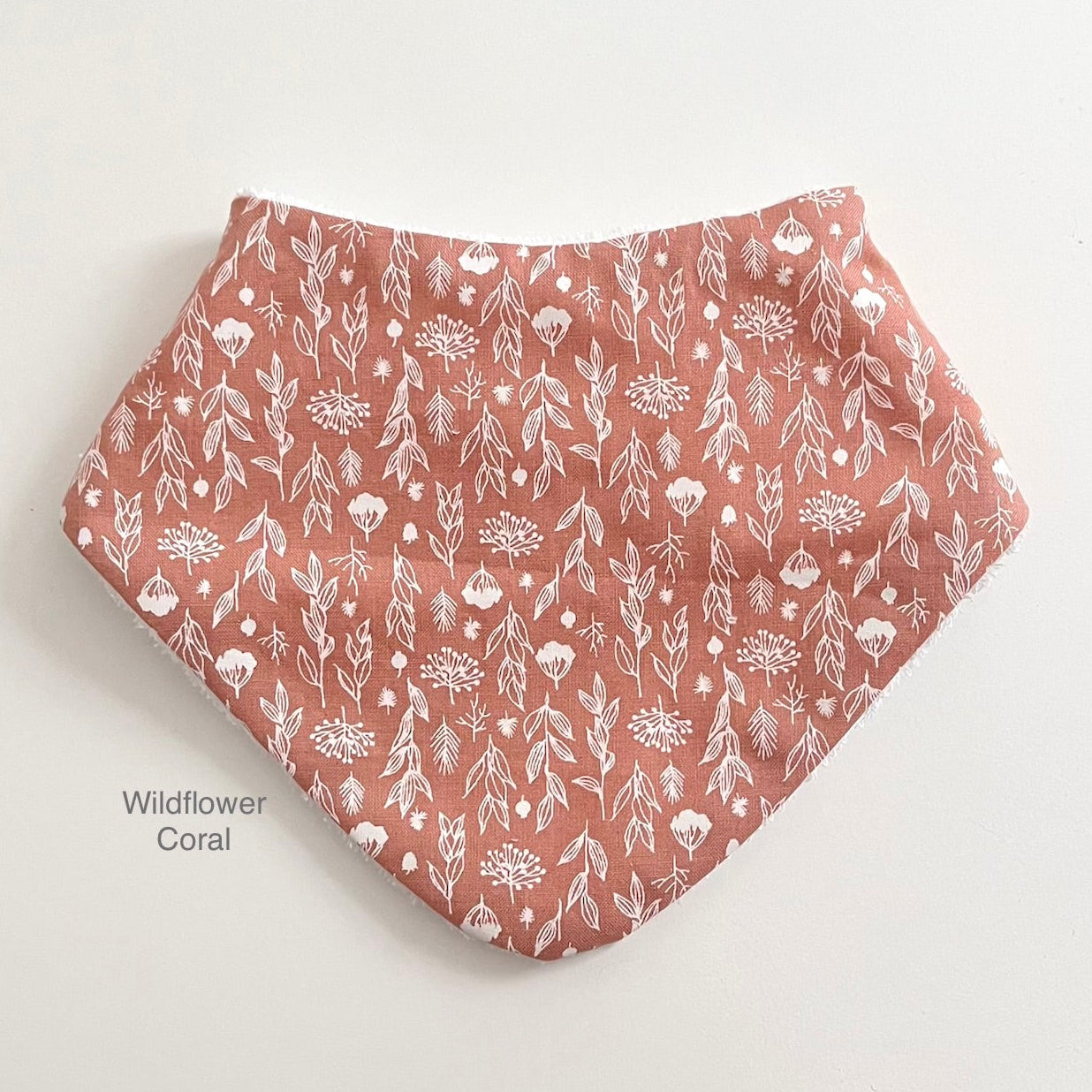 Wildflower dribble bib in coral colour
