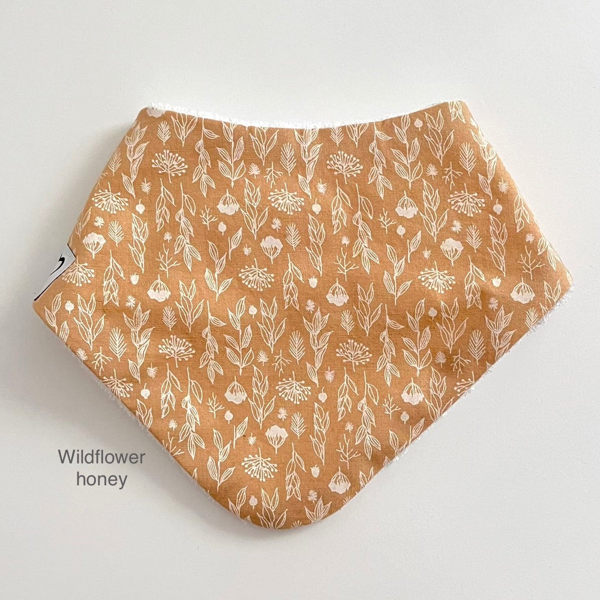 Wildflower dribble bib in honey colour
