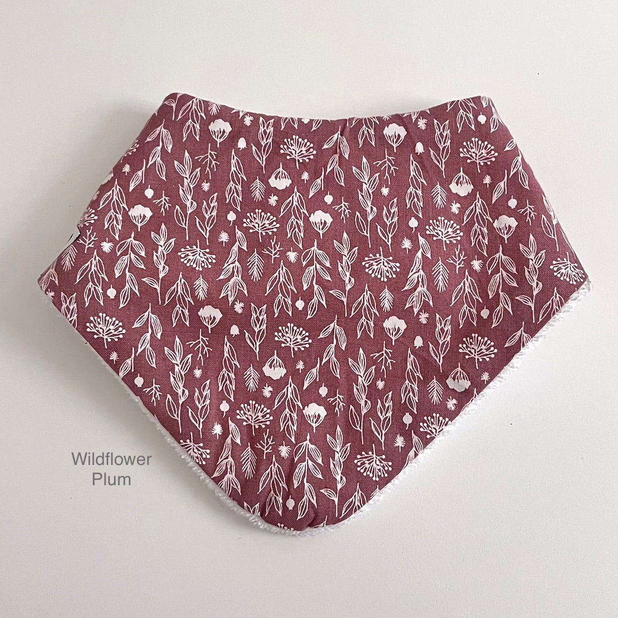 Wildflower dribble bib in plum colour