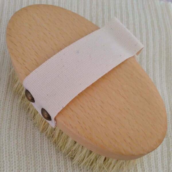 Pet brush showing strap for hand 