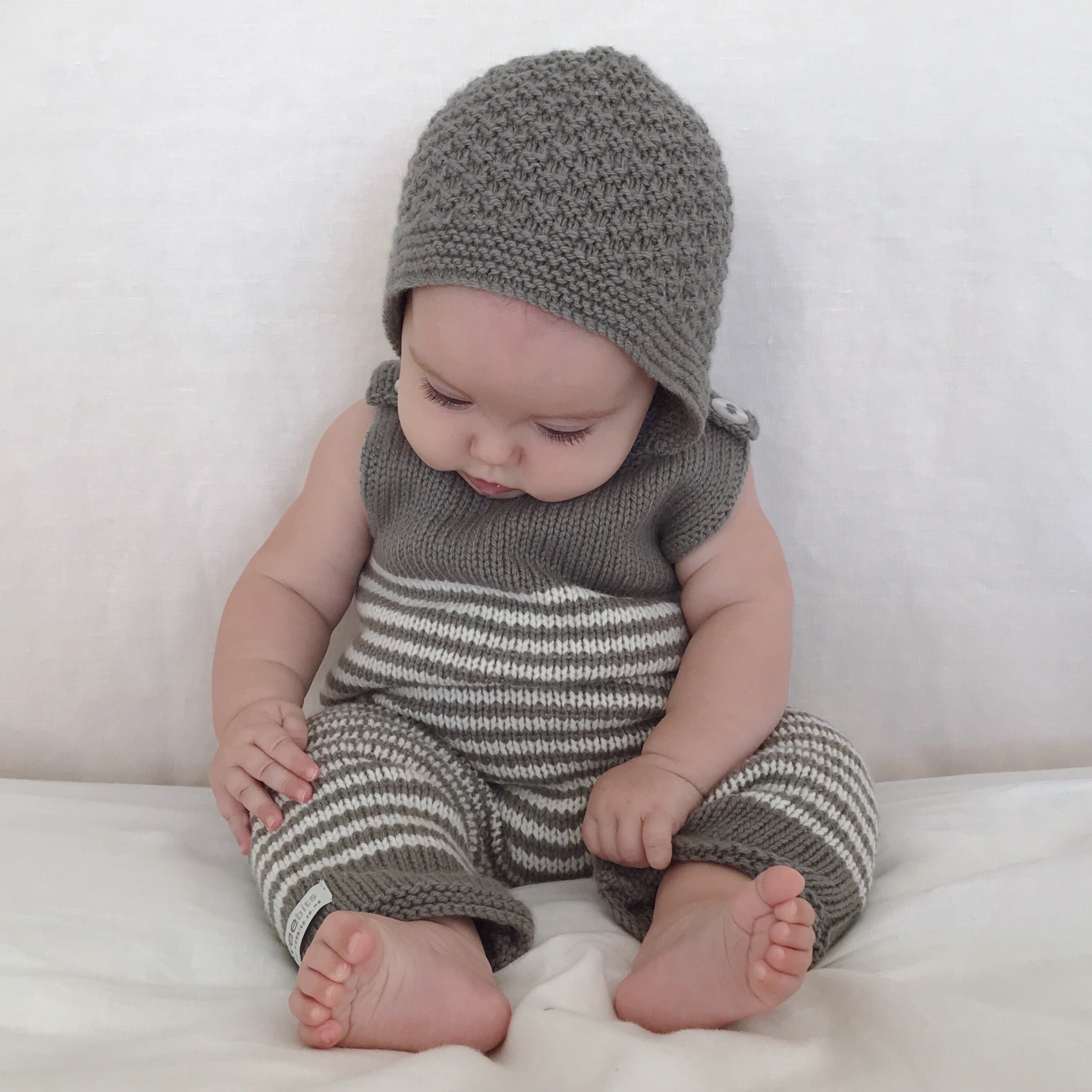 Baby wearing  mushroom knitted newborn bonnet