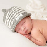 baby wearing mushroom striped beanie