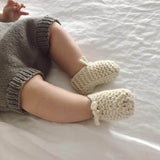 Baby wearing natural chunky booties
