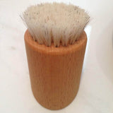 Front view of wooden facial brush
