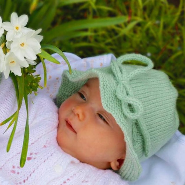 Girl in mint baby brim hat