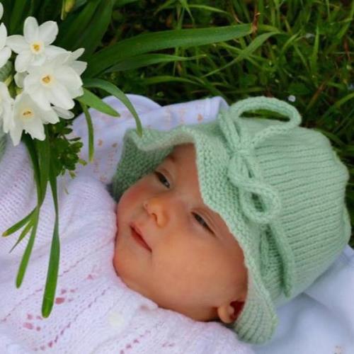 Girl in mint baby brim hat