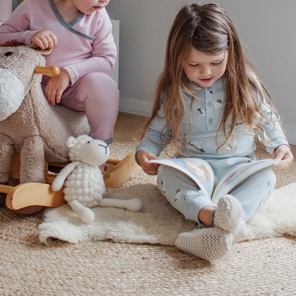Girl in natural toddler slippers