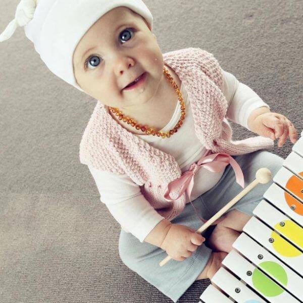 Girl in pink baby girl waistcoat