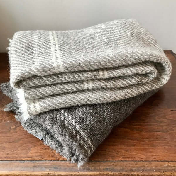 Grey and light grey cot blankets