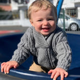 infant in mushroom baby Aran jumper