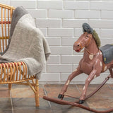 Light grey Stansborough baby wrap in nursery