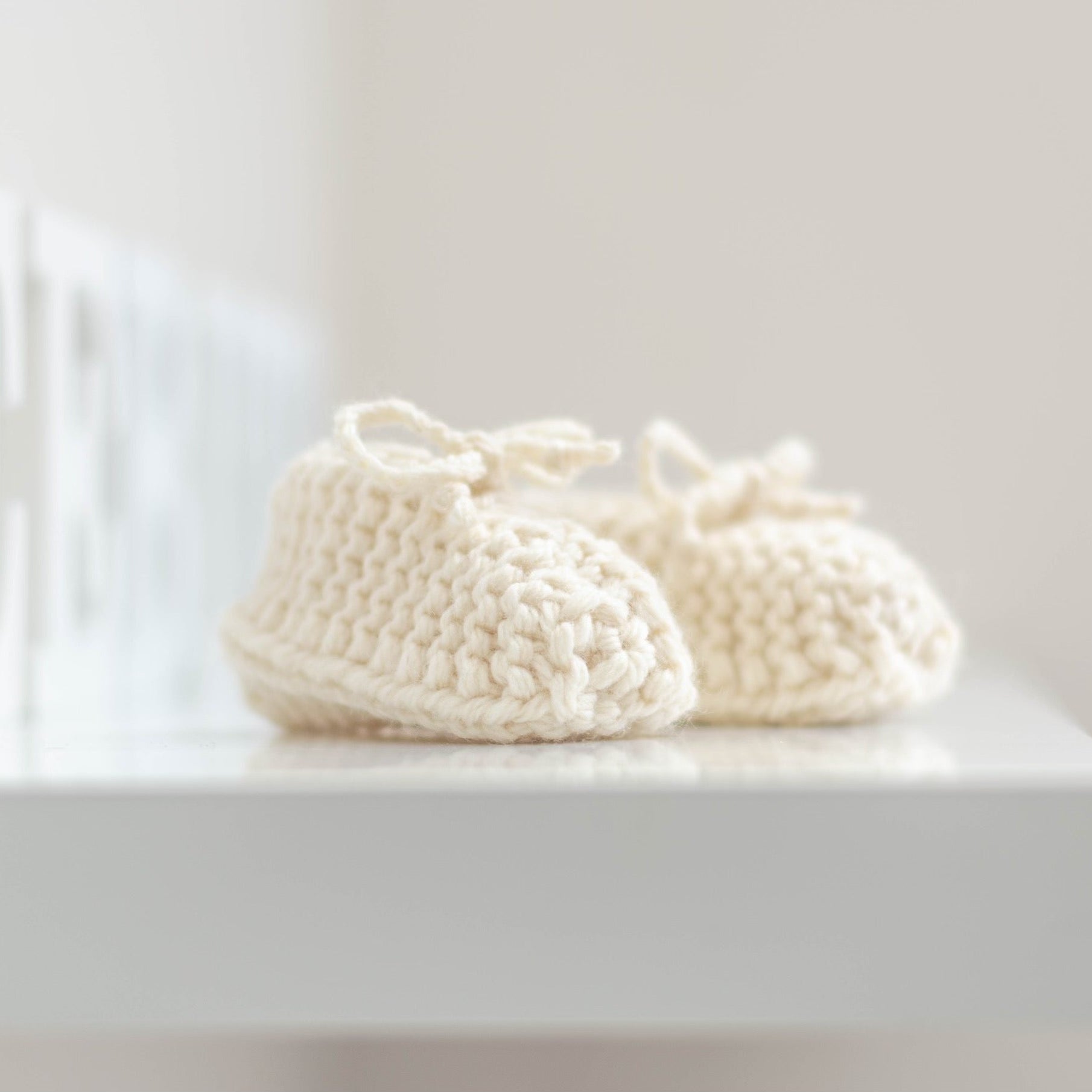 Natural chunky knit booties on shelf