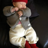 Natural knitted baby pants with ankle ties